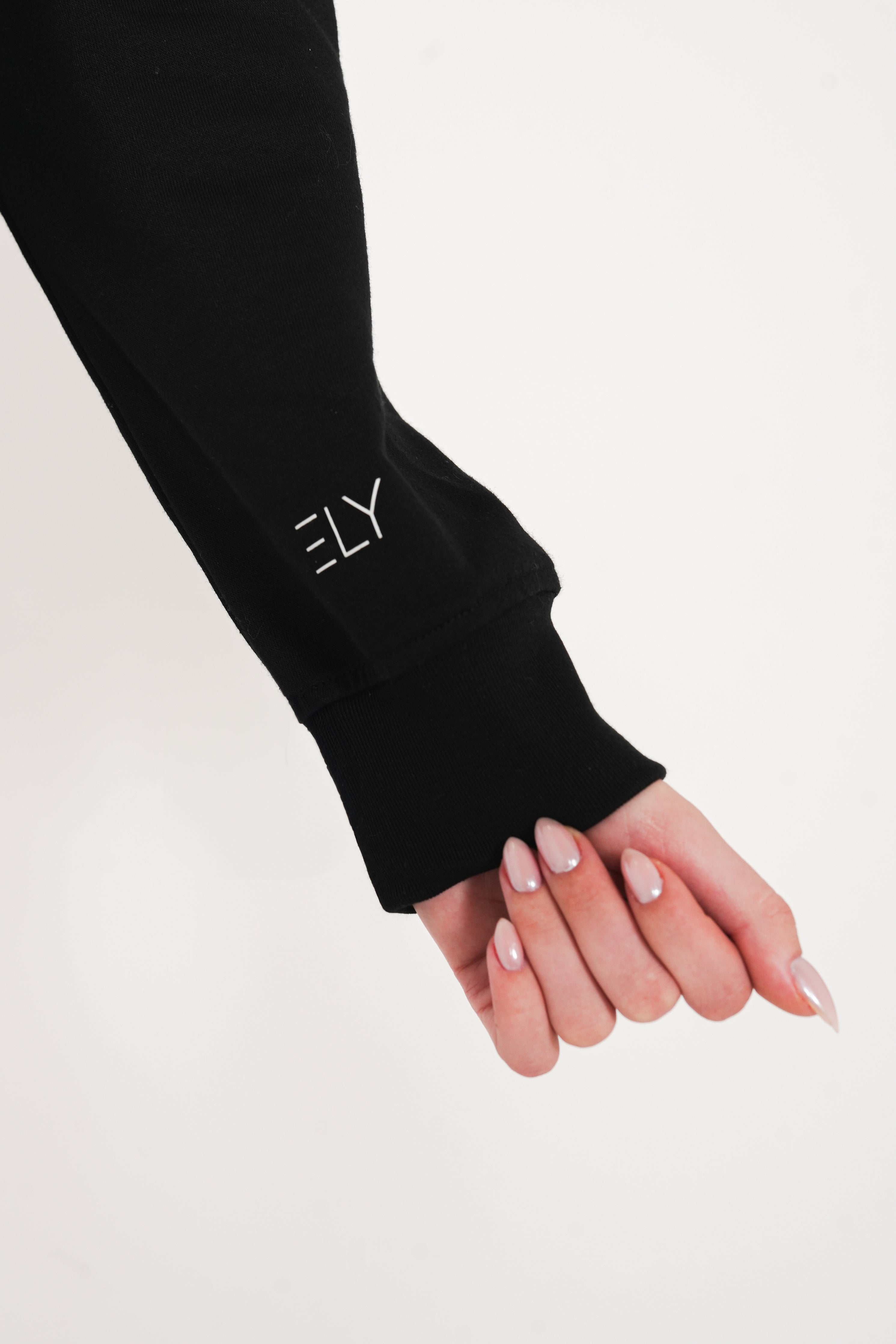Pull court Slogan ELY à demi-zip